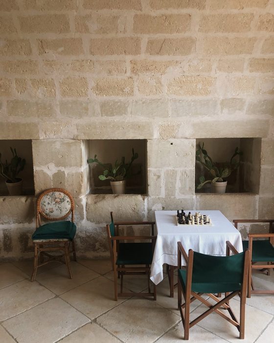 A game left mid play in the vaulted room, Puglia