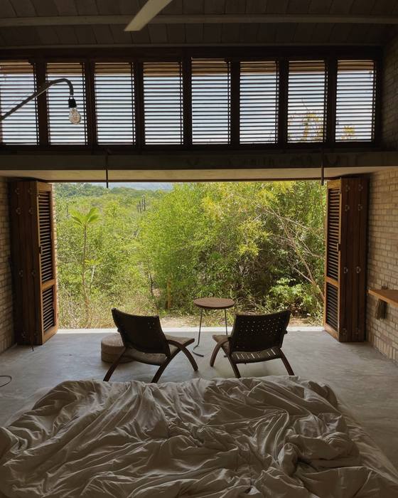 The room at Hotel Terrestre, shutters open to the scrub